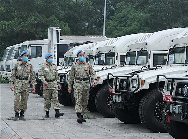 Members of Military Engineer Unit No. 1 examine vehicles before departing for UNISFA. Photo: VNA