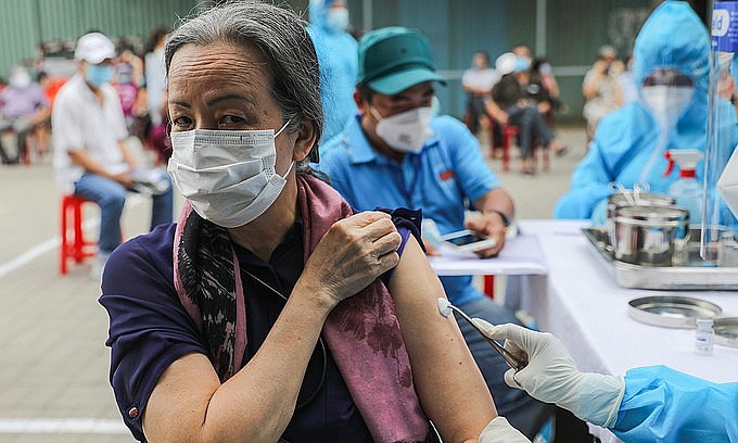 A woman receives a Covid-19 vaccine shot in HCMC's Go Vap District, August 14, 2021. Photo: VnExpress