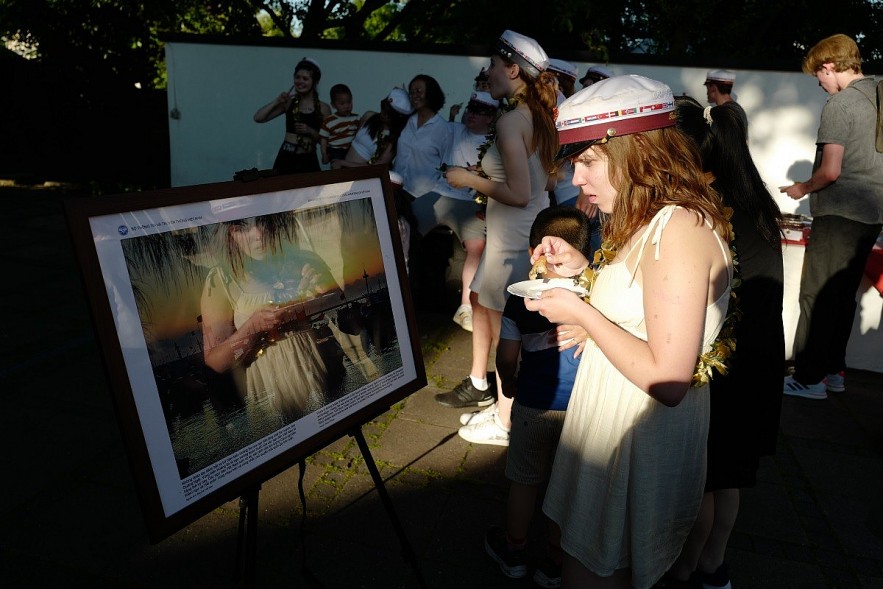 Danish students at the photo exhibition space at the campus of the Vietnamese Embassy in Denmark. Photo: Thoi Dai