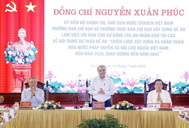 President Nguyen Xuan Phuc (centre) chairs the meeting in Hanoi on July 12. (Photo: VNA)