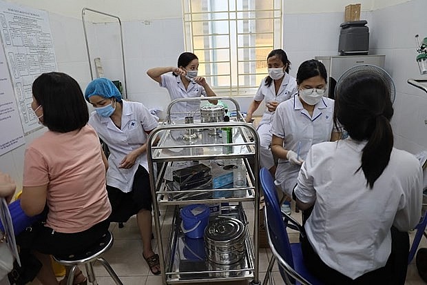 The total number of doses of COVID-19 vaccines injected in Vietnam hit 241,023,060. Photo: VNA