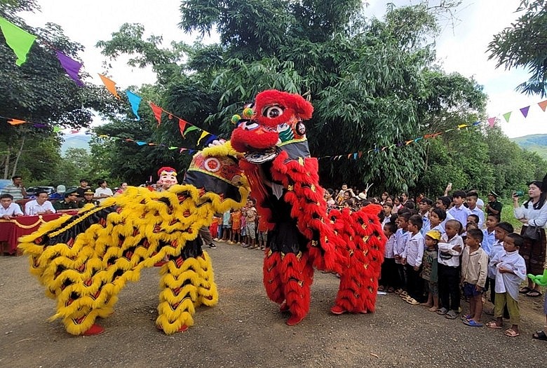The children of Vietnam and Laos were very excited and attentive to the lion dance performance.
