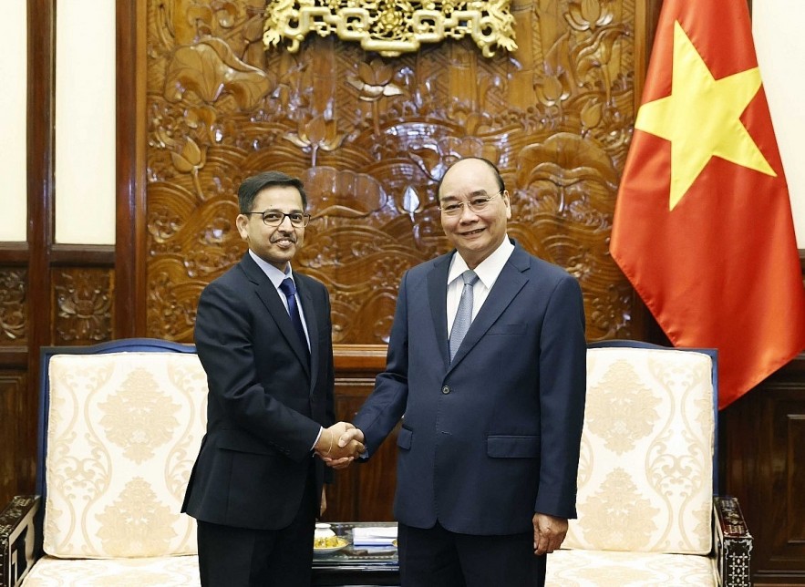 President Nguyen Xuan Phuc (R) welcomes Indian Ambassador Pranay Verma 