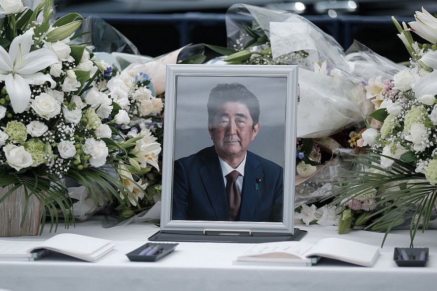 A photograph of former Prime Minister Shinzo Abe at a makeshift memorial in Tokyo, on July 11.Photographer: Soichiro Koriyama/Bloomberg