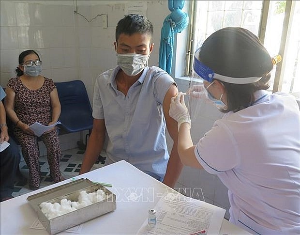 People get vaccinated against Covid-19. Photo: VNA