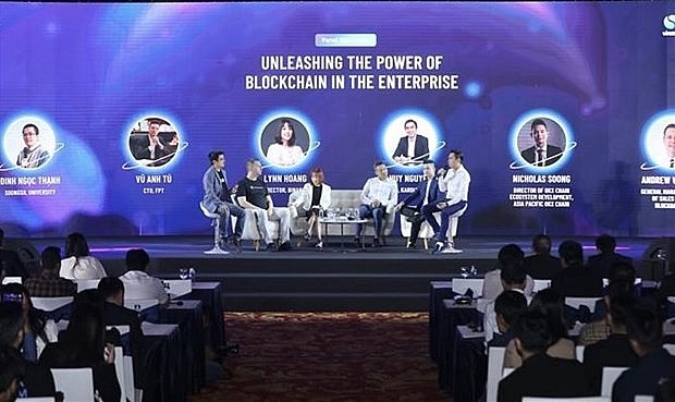 A talkshow held within the framework of Vietnam Blockchain Summit 2022. Photo: VNA