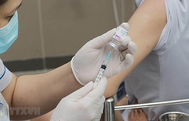 A person gets vaccinated against Covid-19. Photo: VNA