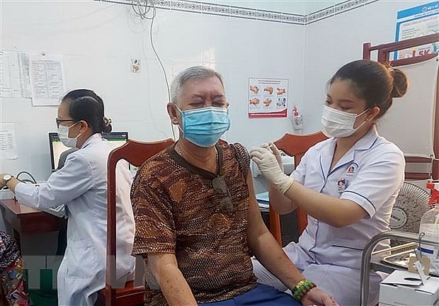A man gets vaccinated against Covid-19. Photo: VNA