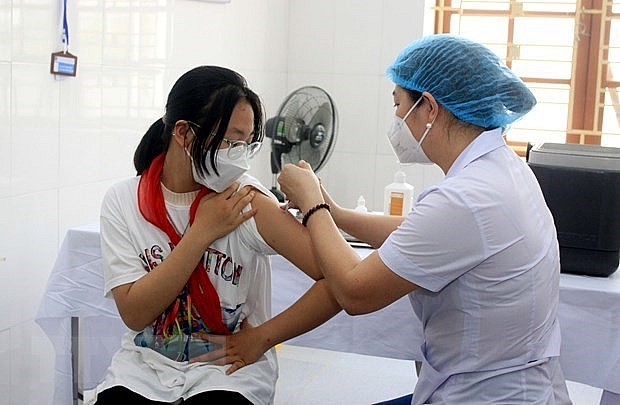 A student gets vaccinated against Covid-19. Photo: VNA