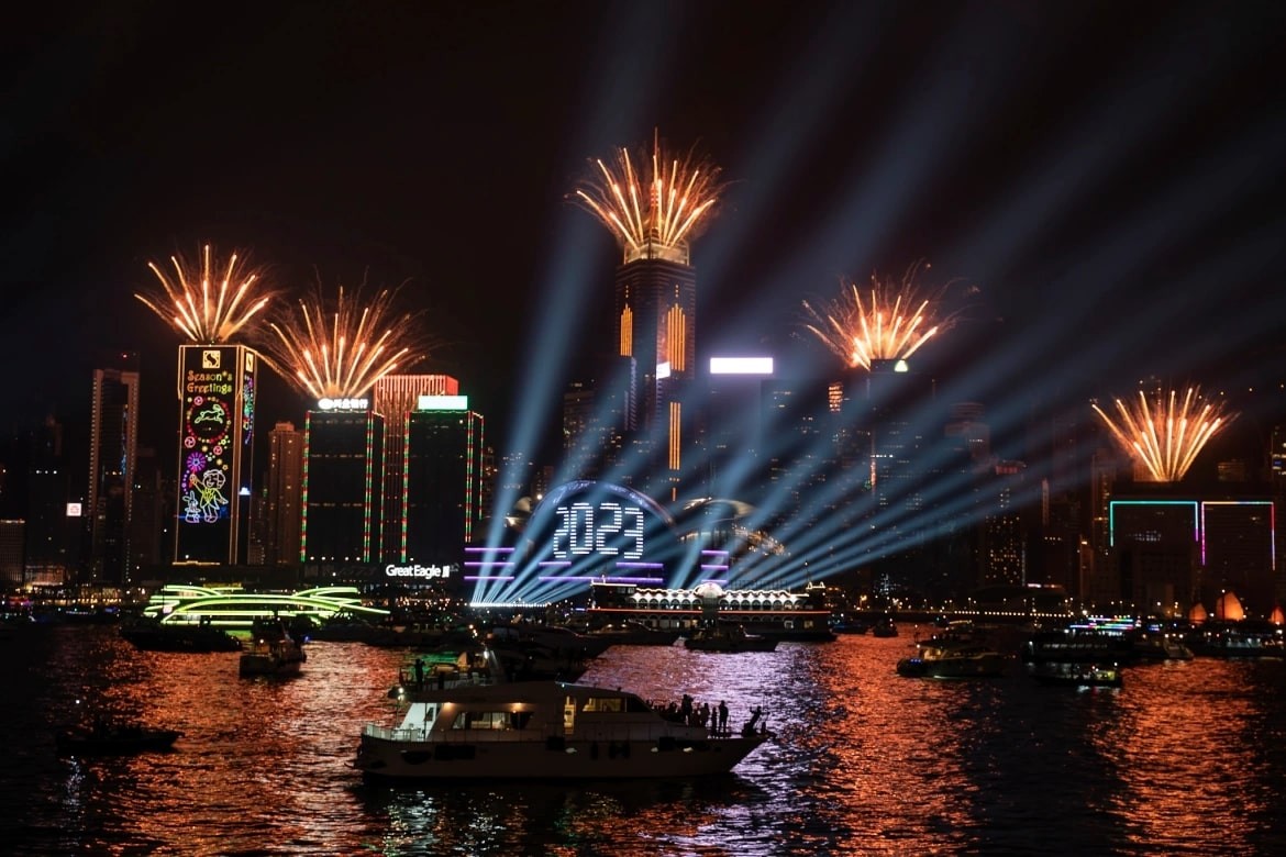 Fireworks are seen over Victoria Harbour at midnight in Hong Kong. [Anthony Kwan/AP Photo]