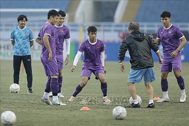 Vietnamese players practice for the match against Indonesia tonight. Photo: VNA