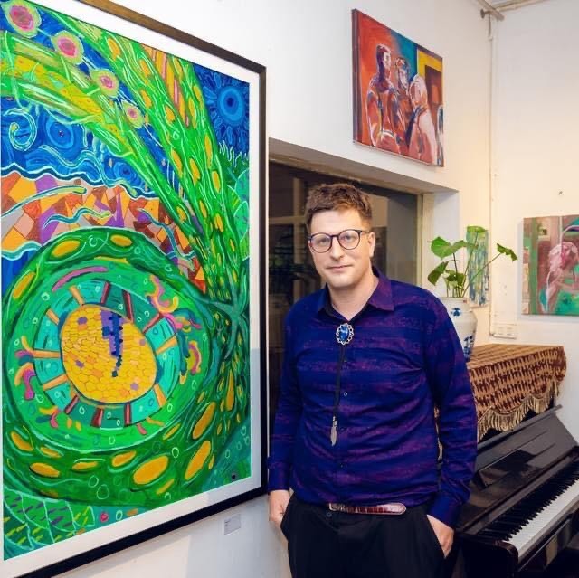 Artist Duncan Griffiths with his past work (Photo courtesy of Duncan Griffiths)
