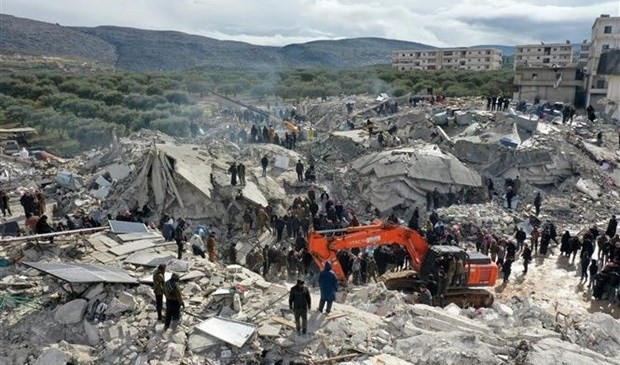 Rescuers and volunteers search for victims and survivors trapped in the rubble after a strong earthquake in the village of Besnia, near the town of Harim, Idlib province Syria, bordering Turkey. Photo: AFP