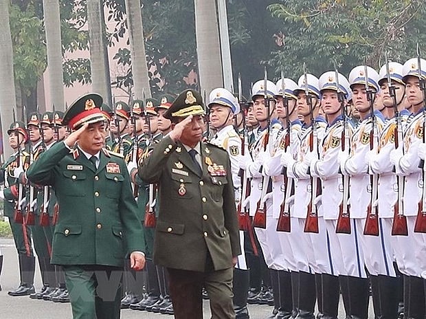 Vietnamese Defence Minister Gen. Phan Van Giang (L) and Cambodian Deputy PM and Defence Minister Gen. Tea Banh review the guard of honour at the welcome ceremony for the latter in Hanoi on February 19. (Photo: VNA)