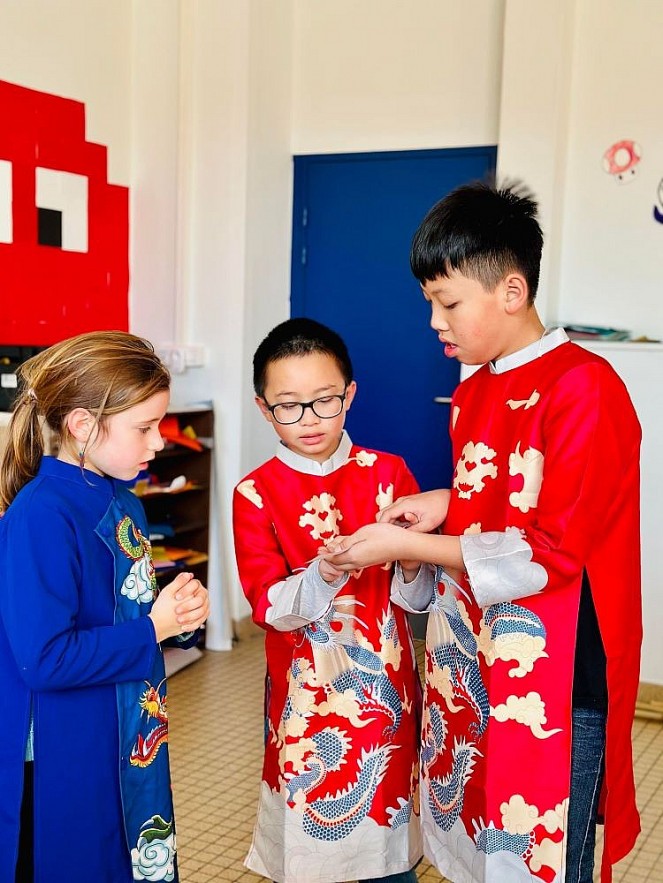 Vietnamese Boy Models the Beauty of Ao Dai in France