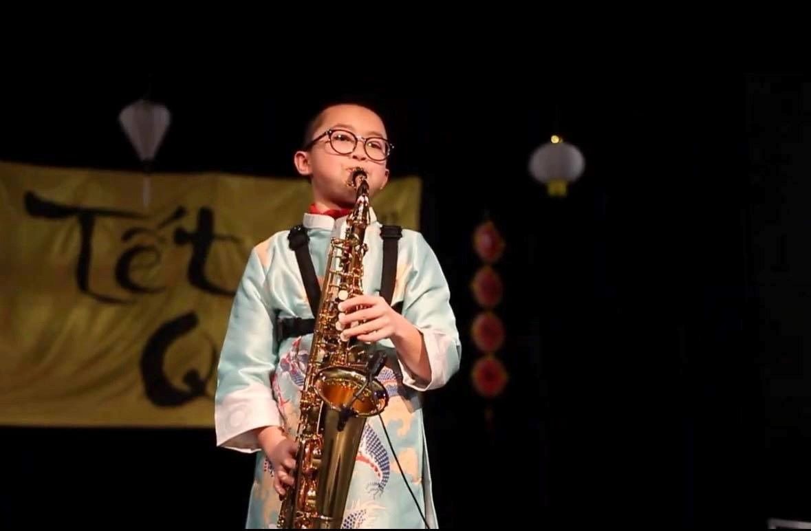 Vietnamese Boy Models the Beauty of Ao Dai in France