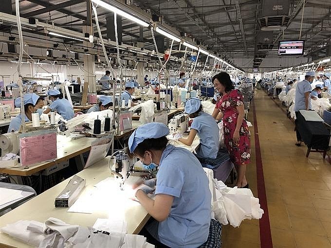  garment workers at a factory in Bình Duong province, Vietnam. Photo: VNS