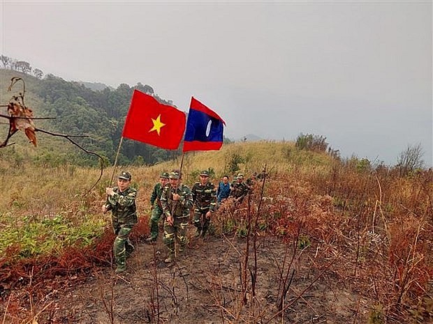 The two sides patrol the border from Marker No 119 to Marker No 121 along the Vietnam-Laos borderline. (Photo: VNA) 