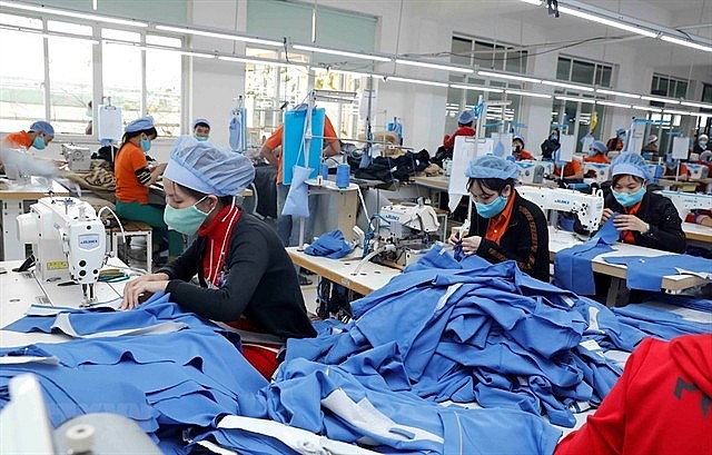Workers during a shift at a textile company in the northern province of Hung Yen. Photo: VNS