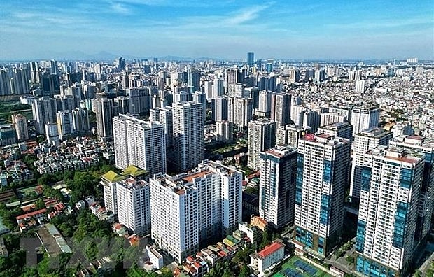 Rising demand for housing in urban areas in the 2021-2030, along with the Vietnamese government’s new policies on land, market transparency and bond issuances, is expected to spur the development of real estate market. (Photo: VNA)