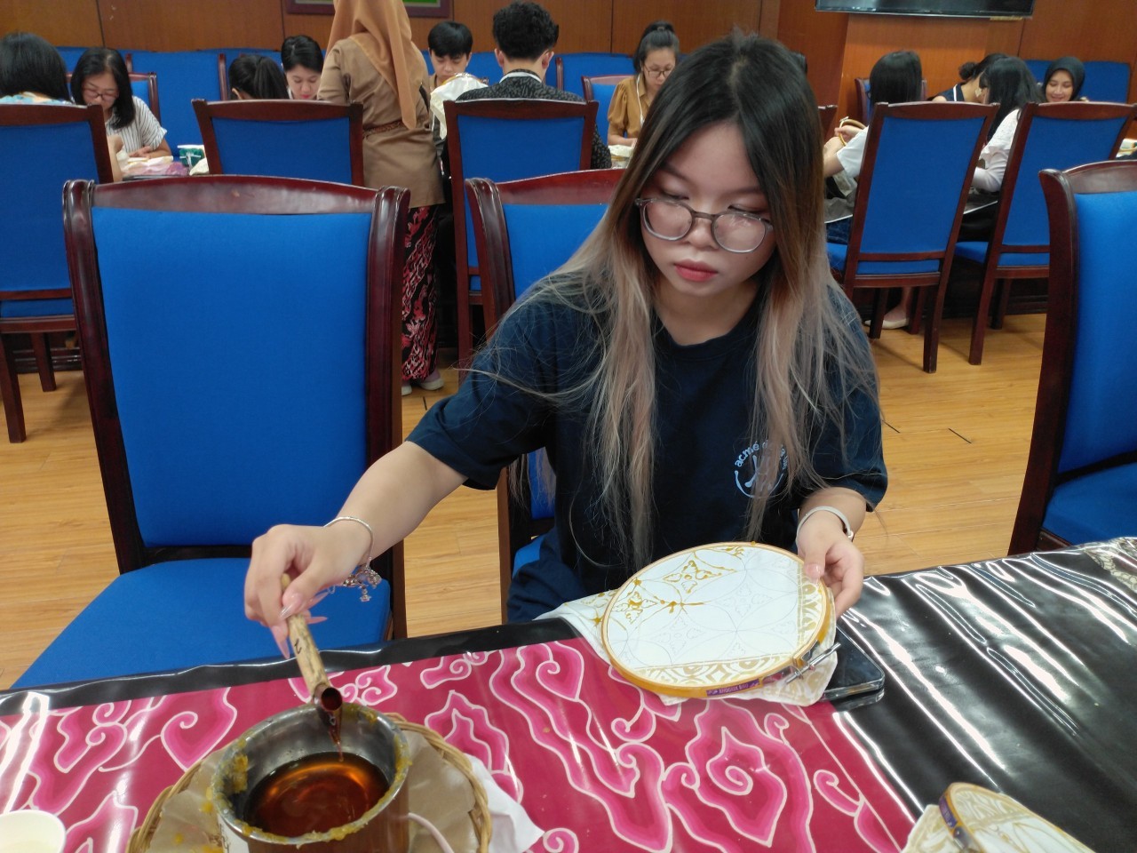 Vietnamese Youth Experience Wax Drawing on Batik Fabric