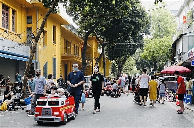 People on the walking street around the iconic Gươm (Sword) Lake in Hanoi. Photo: VNS