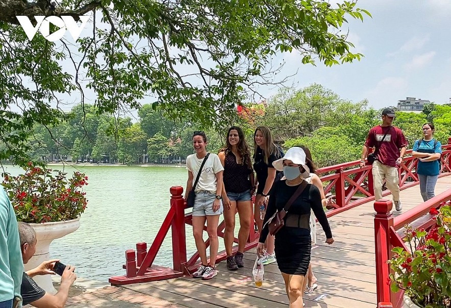 Foreign tourists visit Hoan Kiem Lake in Hanoi.
