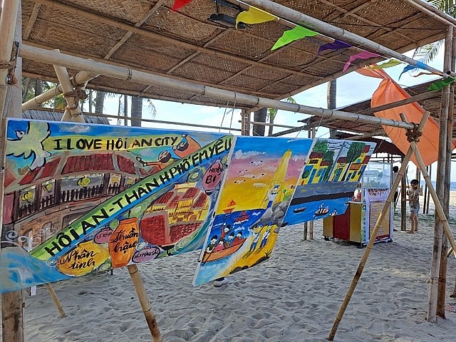 Paintings on display on Cửa Đại Beach in Hội An town. Folk games and plays on the beach attract tourists visiting the town. Photo: VNS