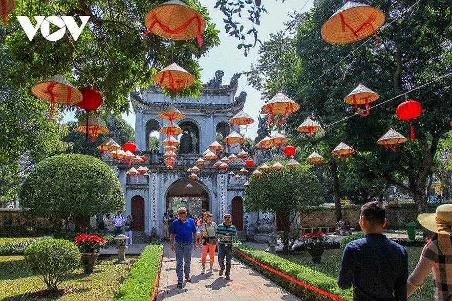Foreigners visit Van Mieu - Quoc Tu Giam, the first university in Vietnam, in Hanoi capital.