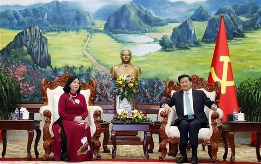 President of Laos Thongloun Sisoulith (R) Bui Thi Minh Hoai and Secretary of the Party Central Committee and Chairwoman of its Commission for Mass Mobilisation