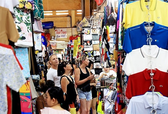 Foreign tourists visiting Bến Thành Market, District 1, HCM City. Photo: VNS