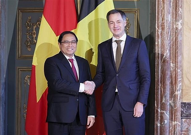 Prime Minister Pham Minh Chinh (L) and Belgian Prime Minister Alexander De Croo. (Photo: VNA)