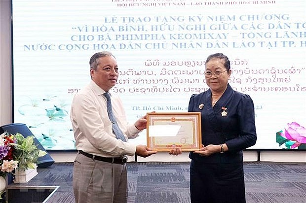 Lao Consul General in HCMC Honored with Friendship Insignia