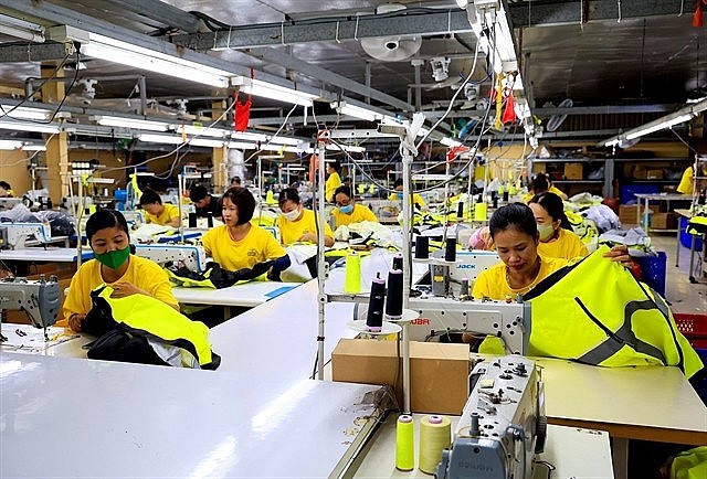 A garment and textile production line at Dony Garment Company Ltd in HCM City. The garment and textile industry will work towards efficient use of resources and waste reduction. Photo: VNA