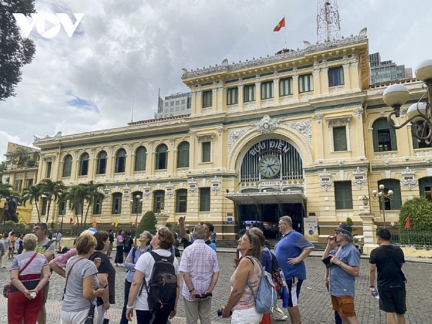 International tourists visit Saigon Central Post Office in Ho Chi Minh City 