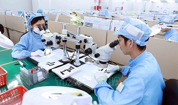 Electronic accessories production at YPE Vietnam company in Binh Xuyen 2 Industrial Park in Vinh Phuc province (Photo: VNA)