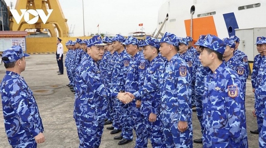 Members of the Vietnam Coast Guard force in a joint patrol at sea with their counterparts of the China Coast Guard force.