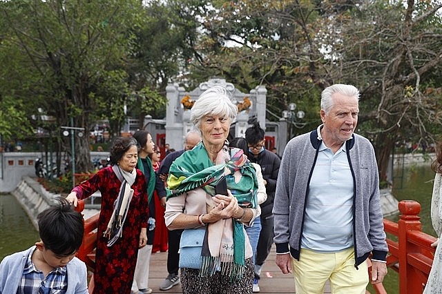 Foreign tourists visiting Ngọc Sơn Temple at Hoàn Kiếm Lake, Hà Nội in February 2024. — VNA