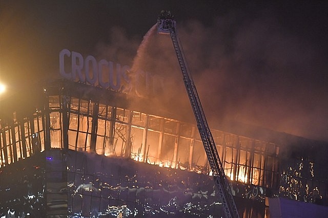 Firefighters battling flames at the scene of a terrorist attack targeting the Moscow-area concert venue on March 22, 2024. Photo: VNS