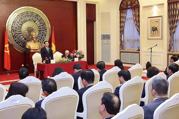 NA Chairman Vuong Dinh Hue speaks at the meeting with representatives of the Vietnamese Embassy and community in China. Photo: VNA