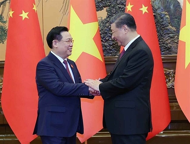 Việt Nam's National Assembly Chairman Vương Đình Huệ meets with the General Secretary of the Communist Party and President of China Xi Jinping on Monday.