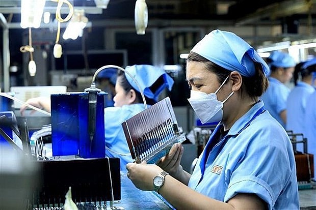 Workers at a factory of the Japanese-invested Sankoh Vietnam Co. Ltd in Hoa Binh province (Photo: VNA)