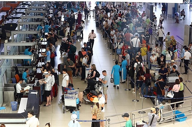 Passengers at the domestic terminal of Nội Bài International Airport in Hanoi. Photo: VNS