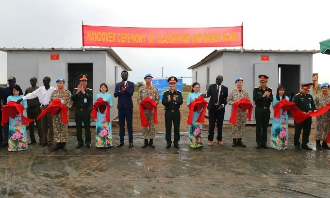 vietnamese soldiers hand over classrooms and kitchen to african children