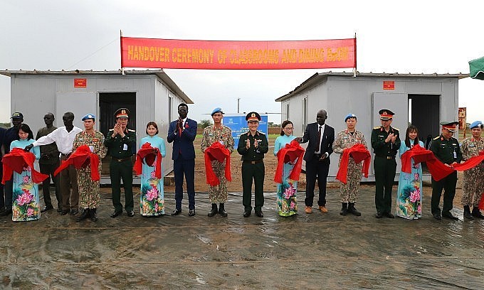 Vietnamese Soldiers Hand Over Classroom and Kitchen to African Children