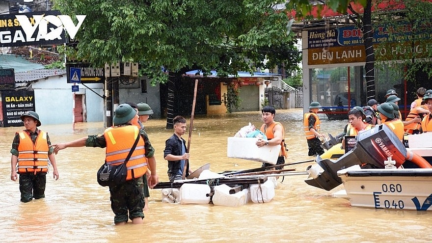 Delivering emergency supplies to people in flood hit areas in northern Vietnam.