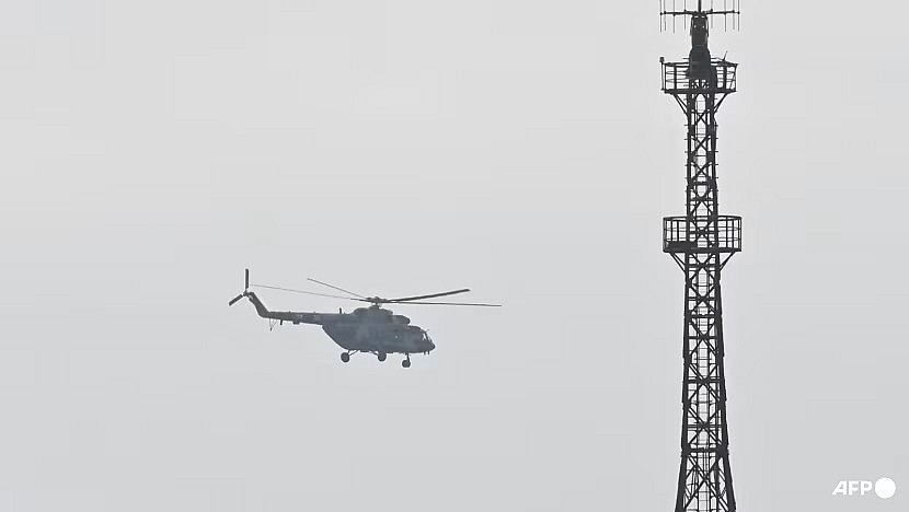 A Chinese military helicopter is pictured in flight, on Apr 7, 2023. (File photo: AFP/Greg Baker)