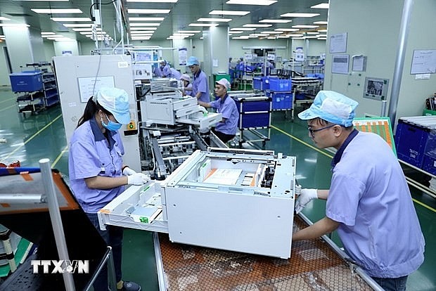 Vietnam’s economic growth momentum has been relatively strong, with improvement recorded in multiple sectors, such as imports-exports, retail sales, real estate, tourism, construction, and manufacturing. (Photo: VNA)