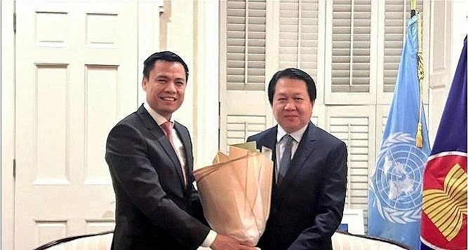 Ambassador Dang Hoang Giang, Permanent Representative of Vietnam to the United Nations (UN) congratulates his Lao counterpart.