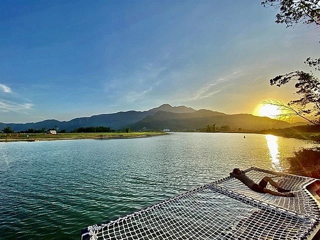 A visitor relaxes at Yen Retreat in Nam Yen village, Hoa Bac commune, Da Nang, which was named one of Asia's top tourist destinations for 2025 by the UK-based travel publication Time Out. (Photo: VNA)